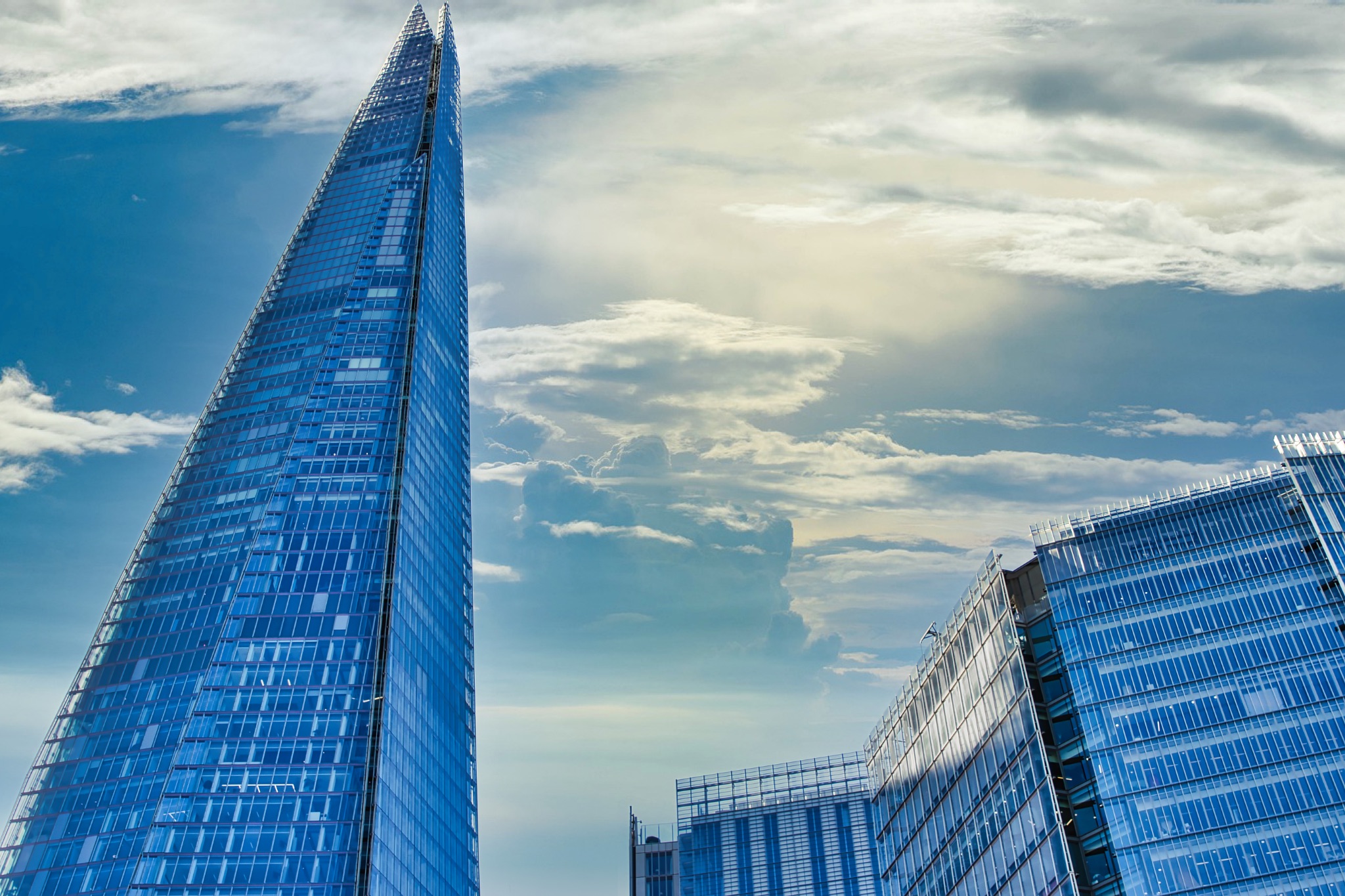 London Shard and Adjacent Skyscrapers under Partly Cloudy Sky