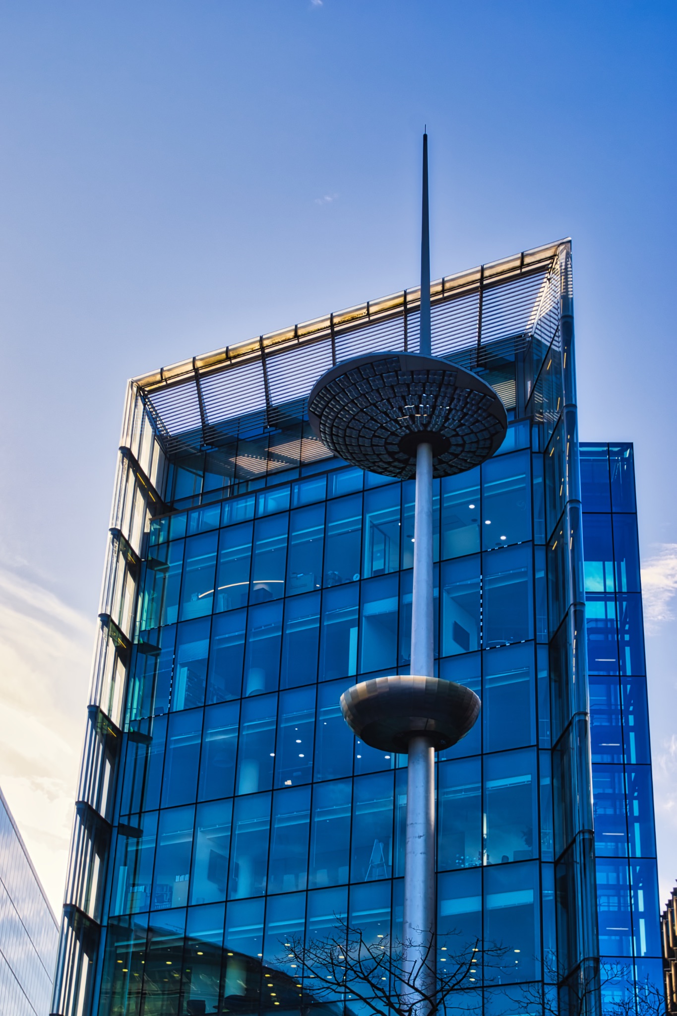 Modern Glass Building with Central Metallic Structure in London, UK.