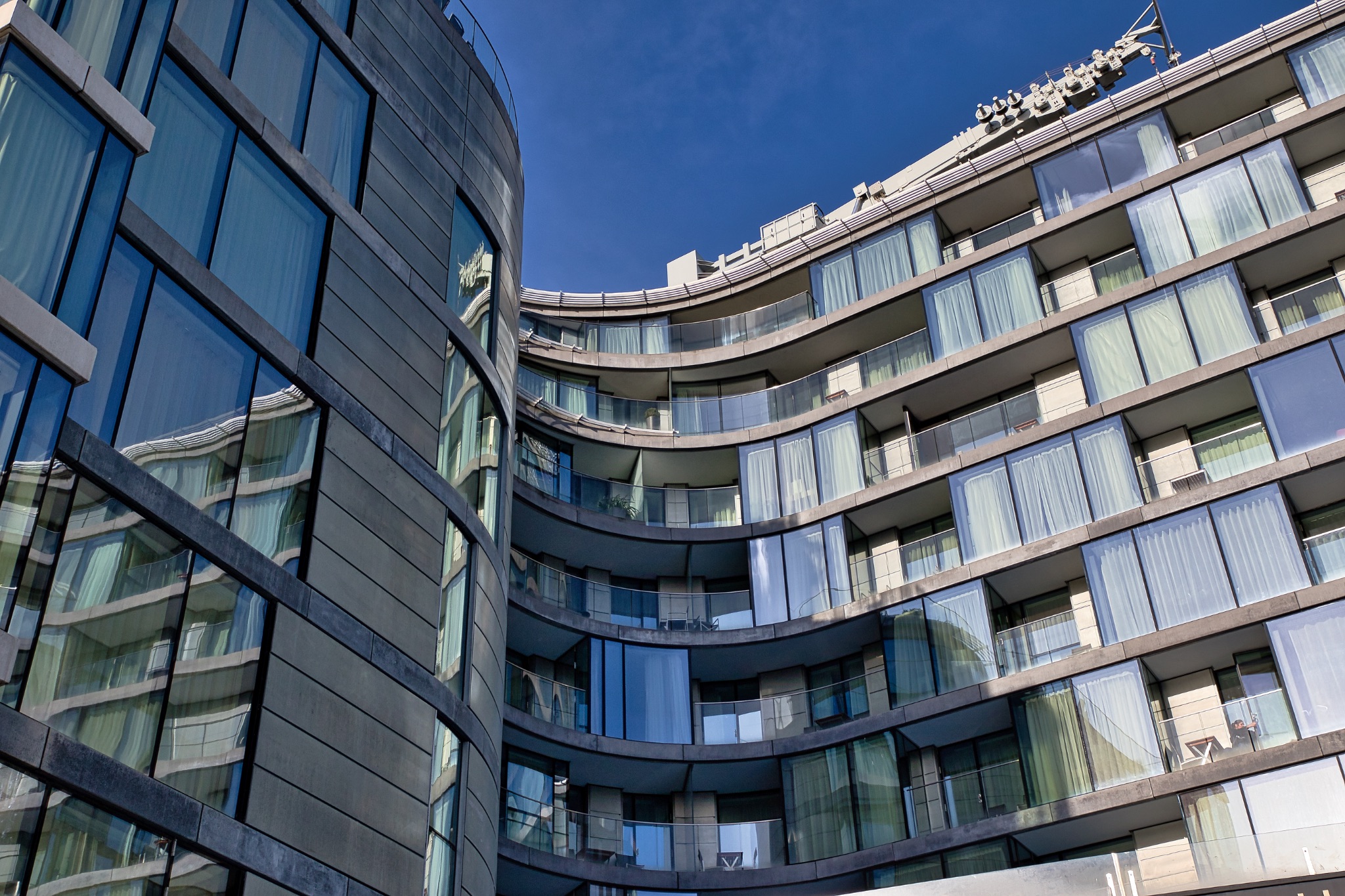 Curved Facade Apartment Buildings with Glass Balconies in London, UK.