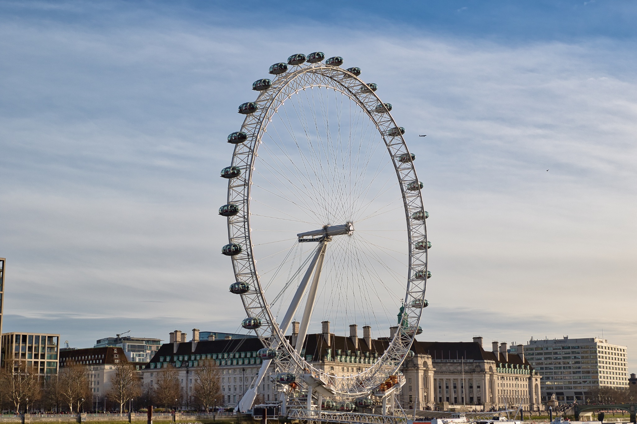 London Eye Ferris Wheel with Cityscape Background