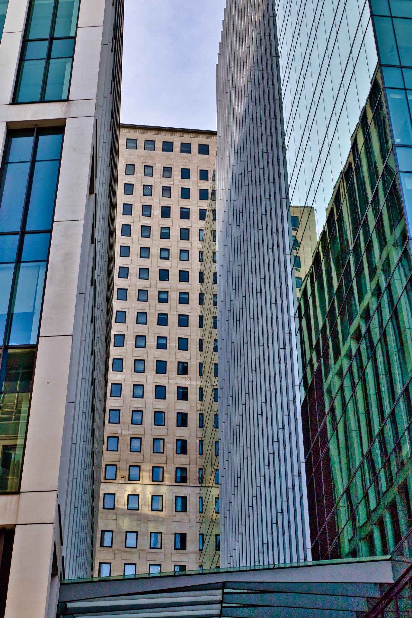 Three Modern Buildings: Architectural Facades and Window Patterns in London, UK.