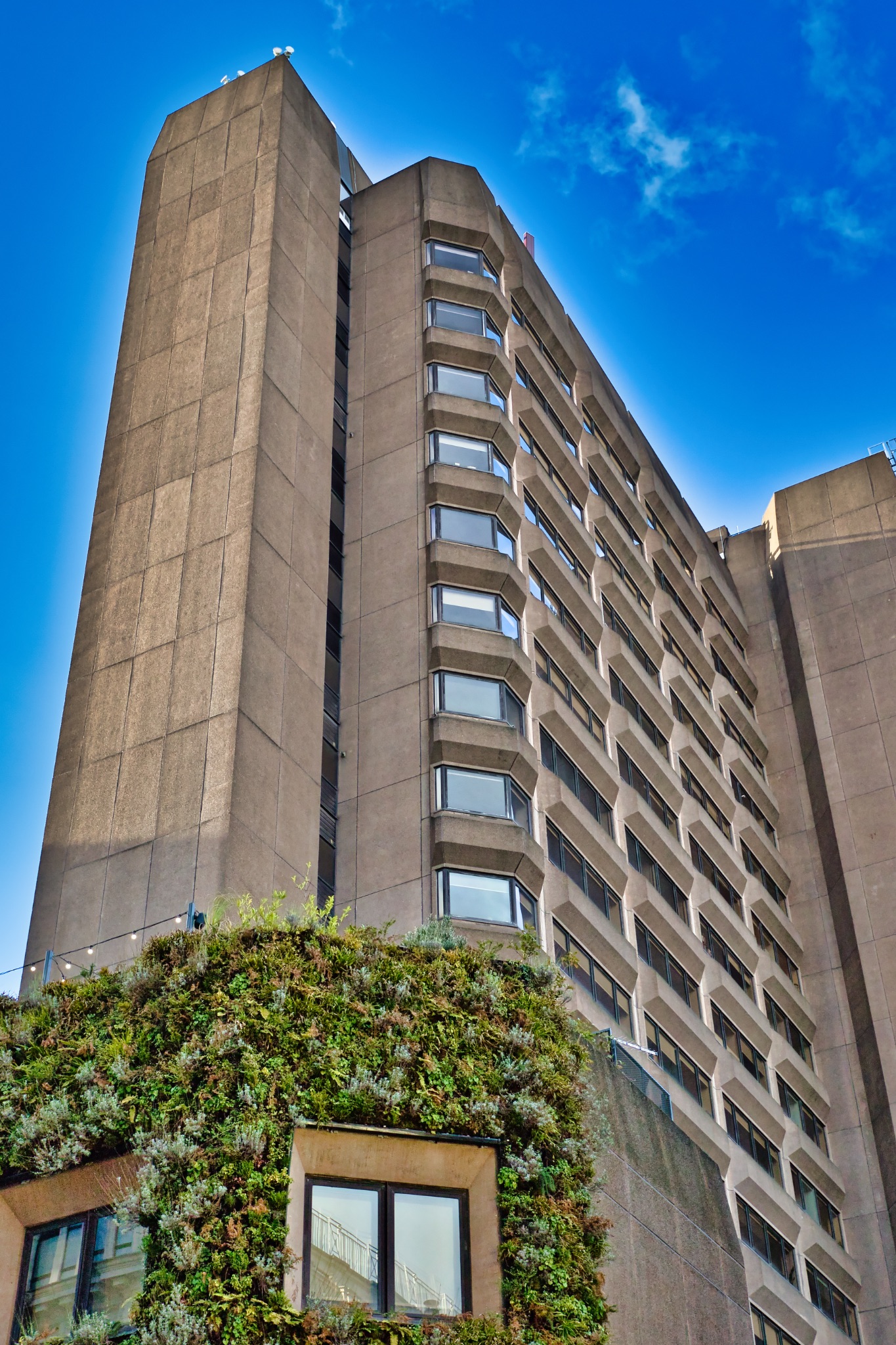 Concrete High-Rise Building with Vertical Garden in Manchester, UK.