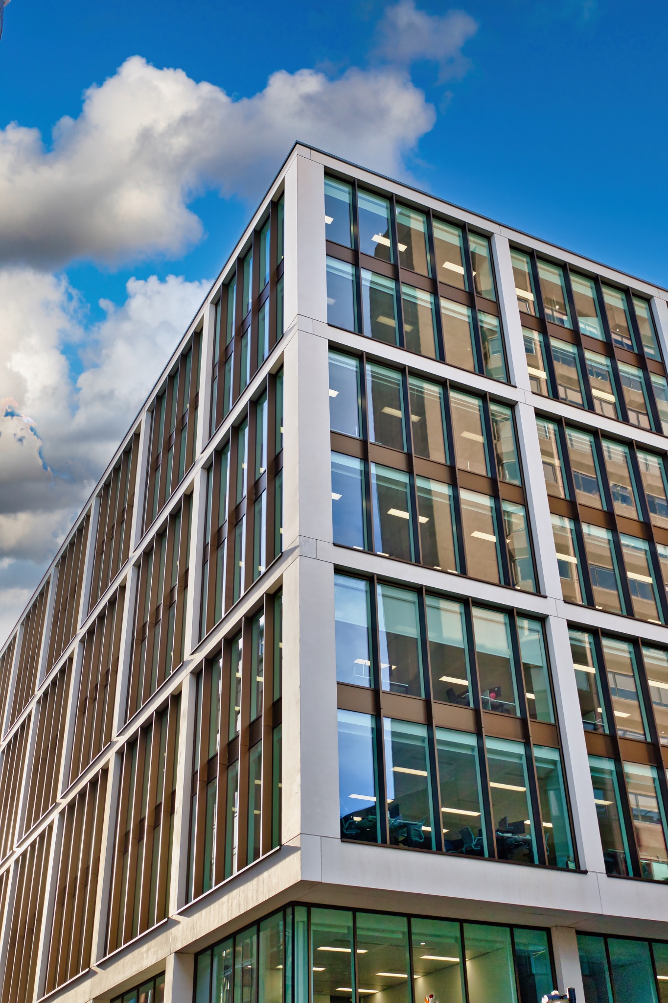Modern Office Building Facade with Glass Windows in Manchester, UK.