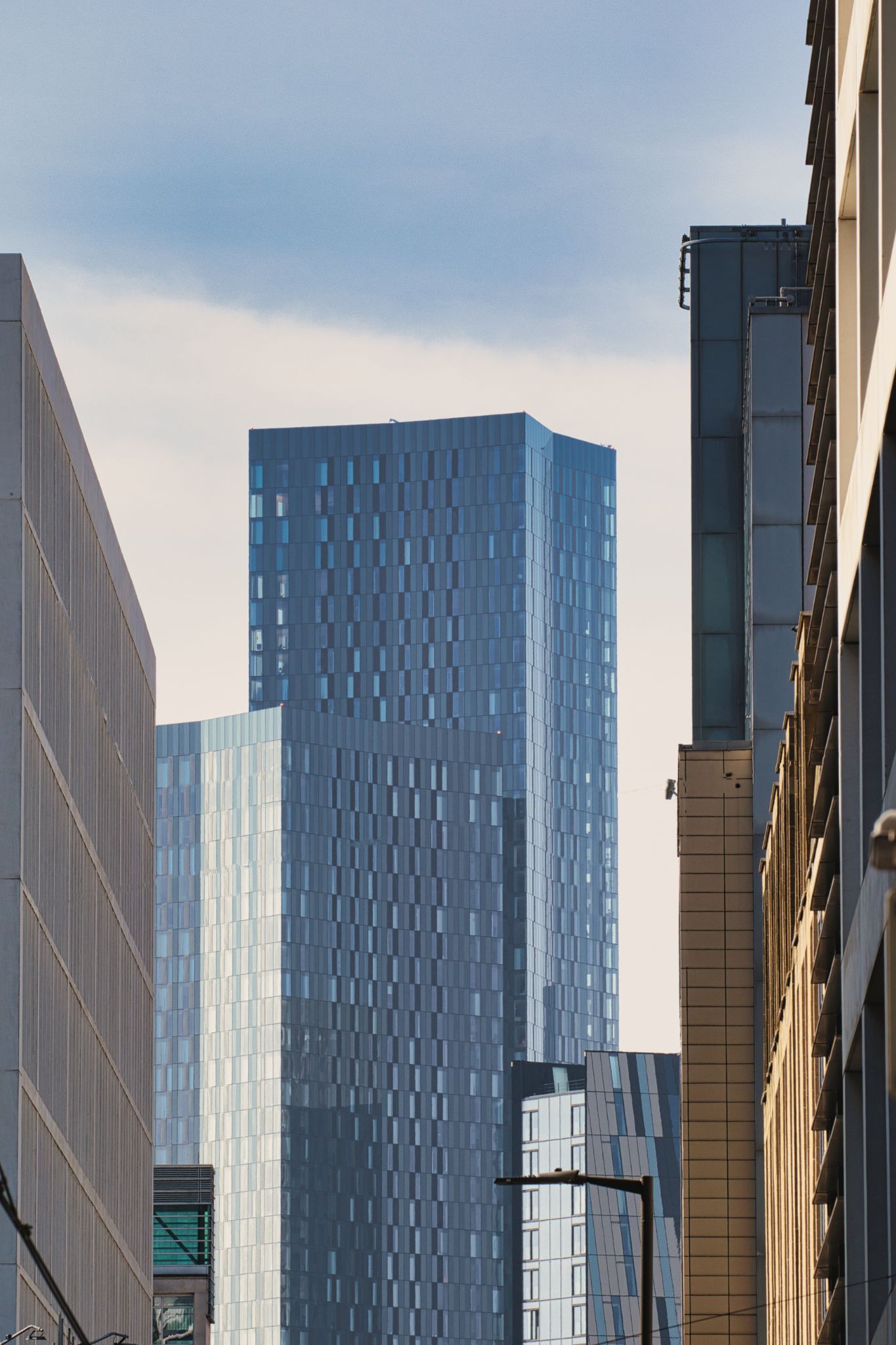 Multiple Modern Buildings Against Sky in Manchester, UK.