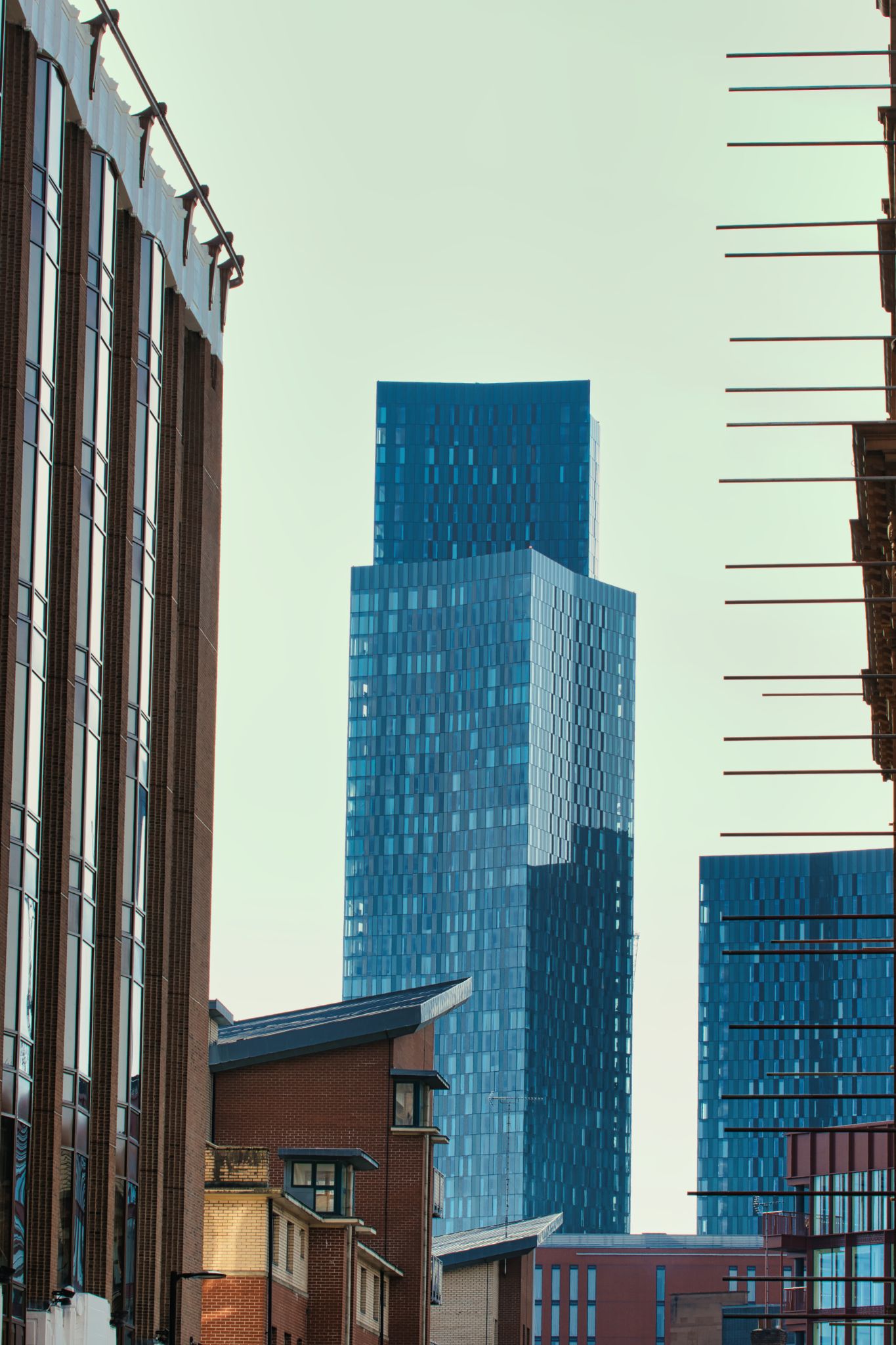 Skyscraper Between Brick Buildings in Manchester, UK.