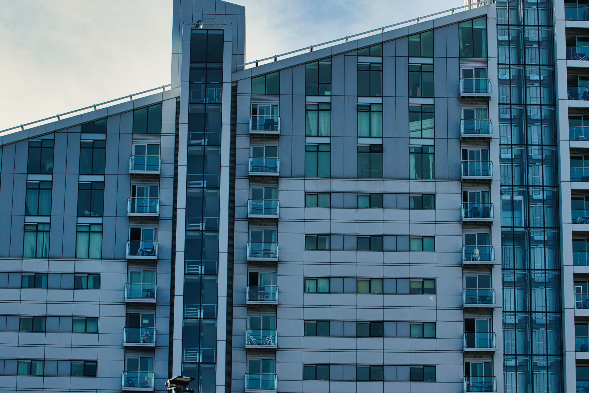 Apartment Building Facade with Windows and Balconies in Manchester, UK.