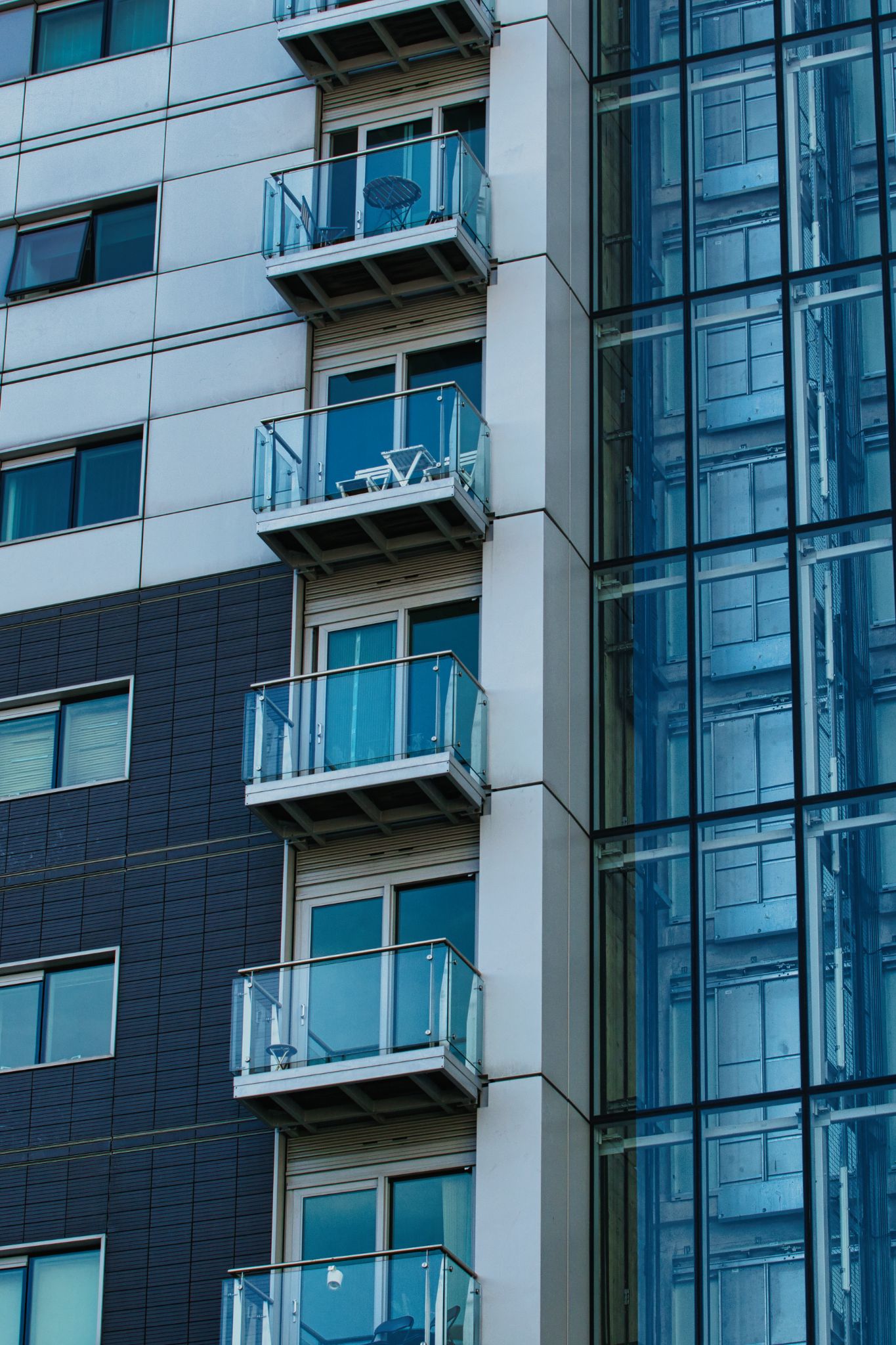 Apartment Building Exterior with Balconies and Glass Windows in Manchester, UK.