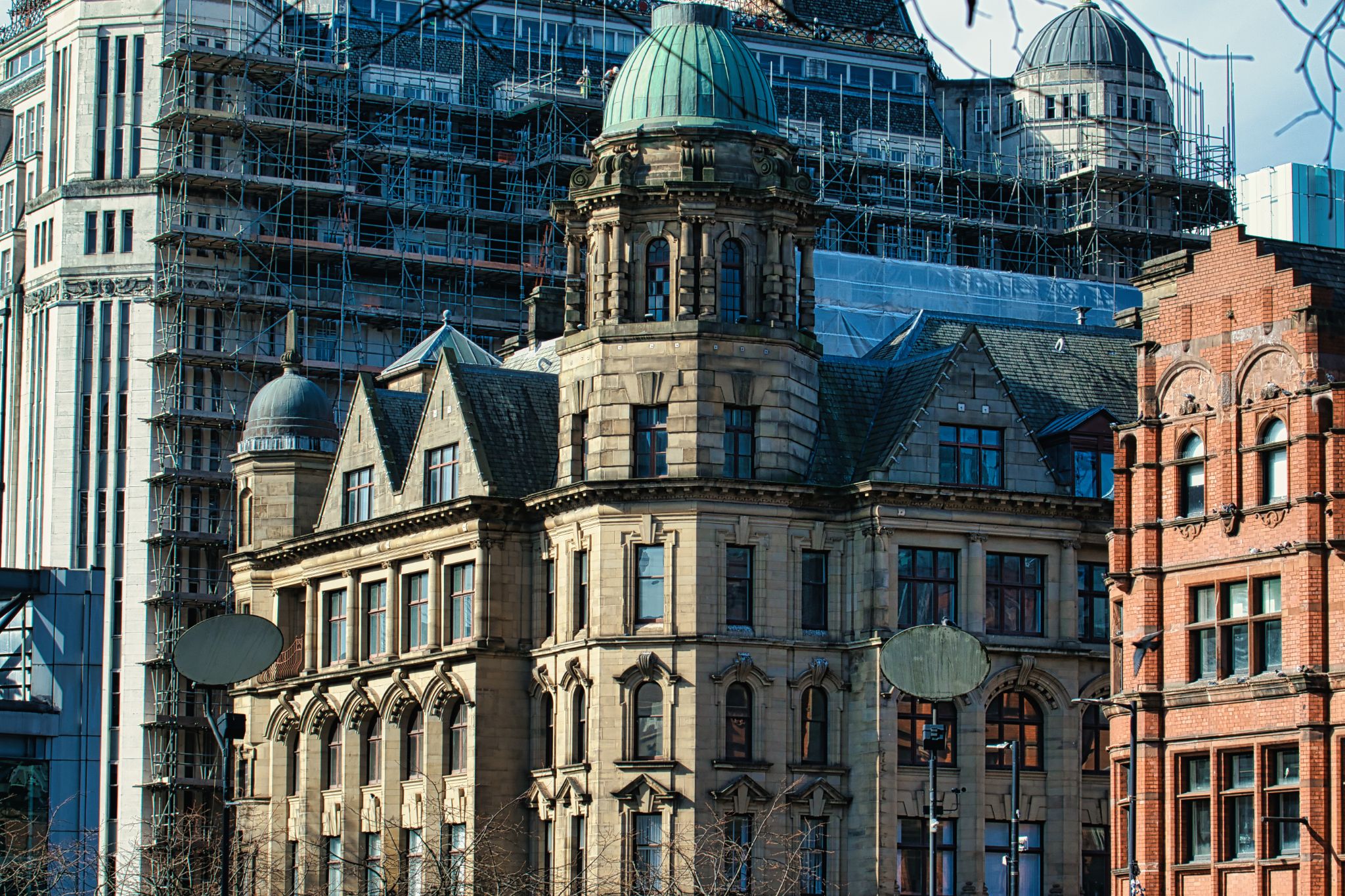 Buildings with Stone, Brick, and Steel Construction in Urban Setting in Manchester, UK.