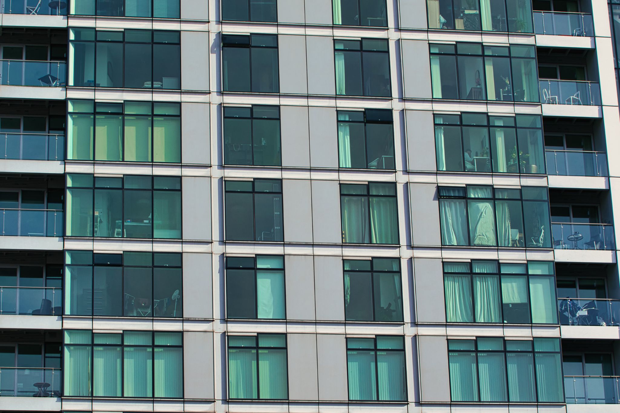 Apartment Building Facade with Windows and Balconies in Manchester, UK.