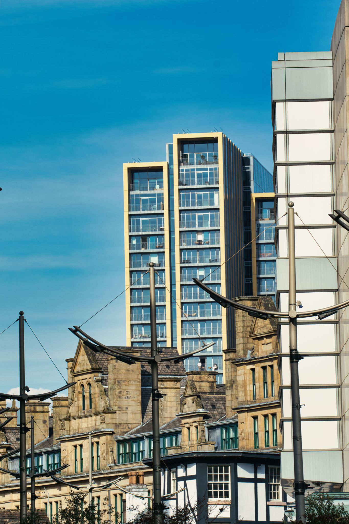 Buildings and Streetlights with Clear Blue Sky in Manchester, UK.