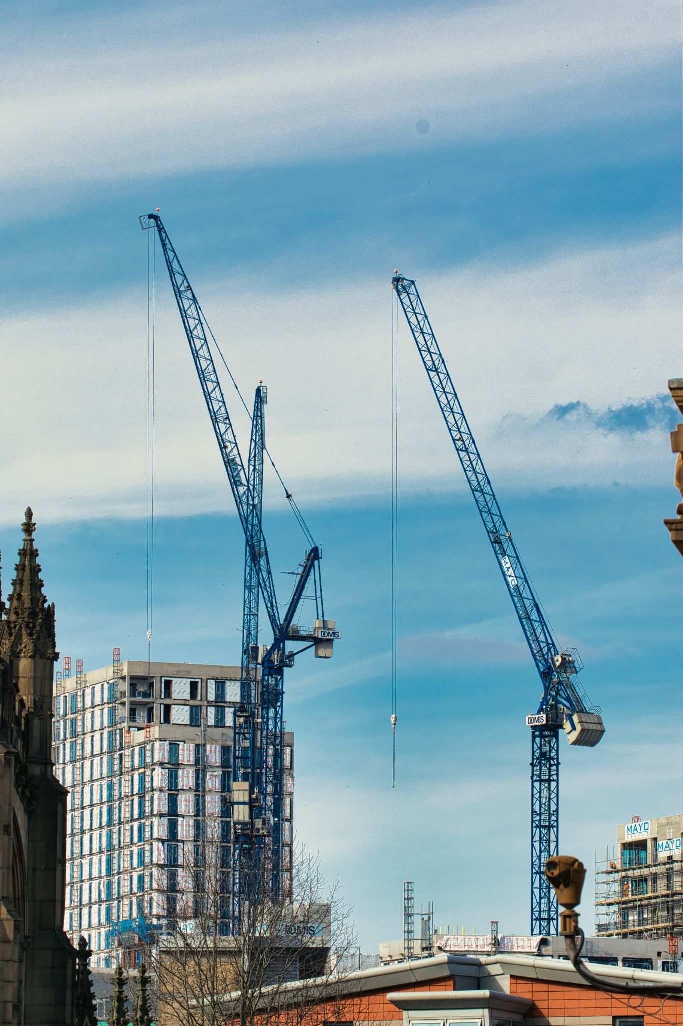 Construction Cranes and Building Under Construction in Manchester, UK.