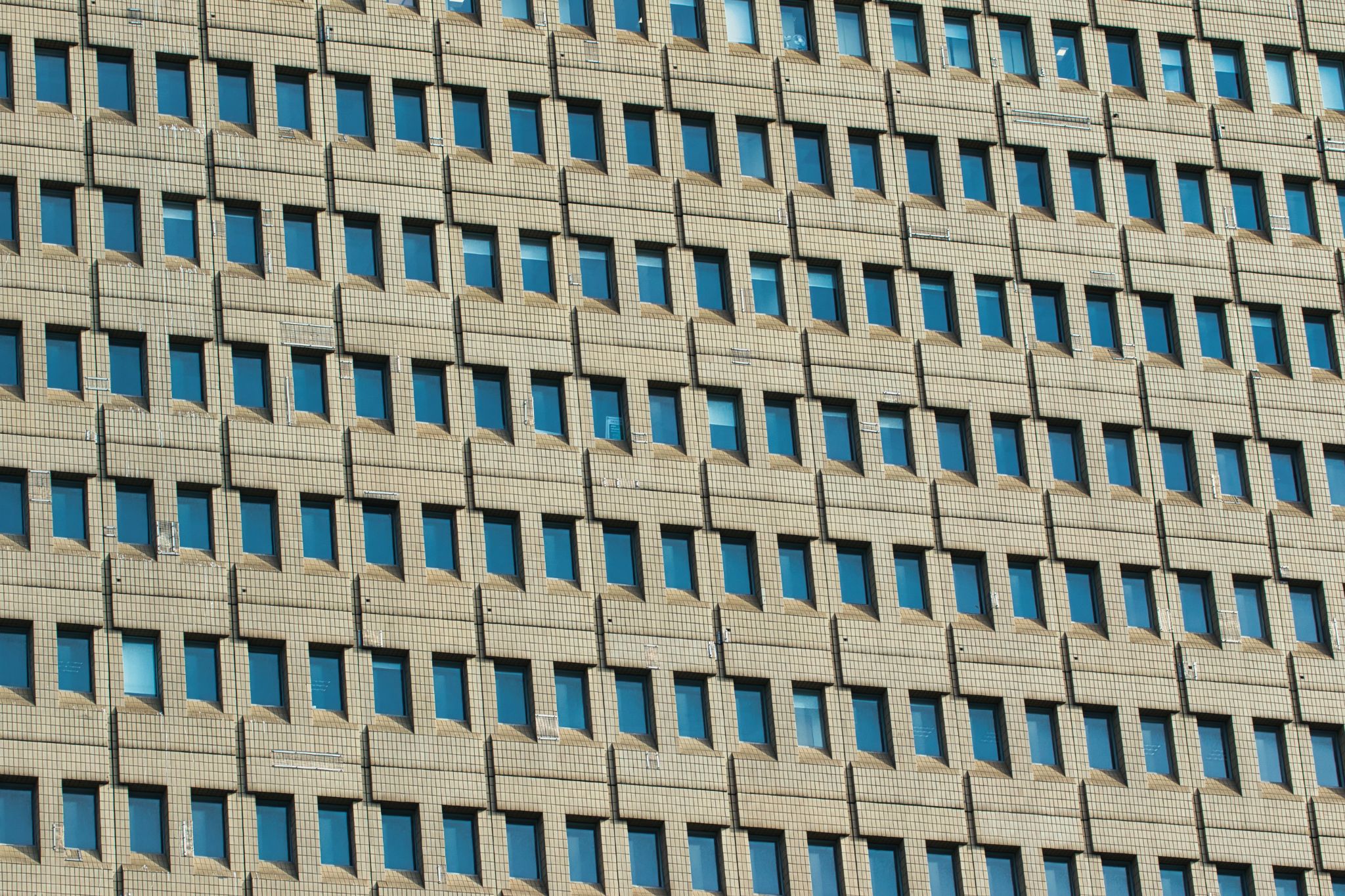 Building Facade with Grid of Windows in Manchester, UK.