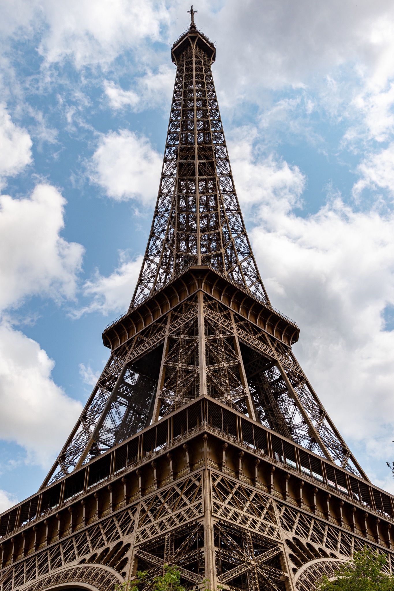 Eiffel Tower Viewed from Below with Cloudy Sky