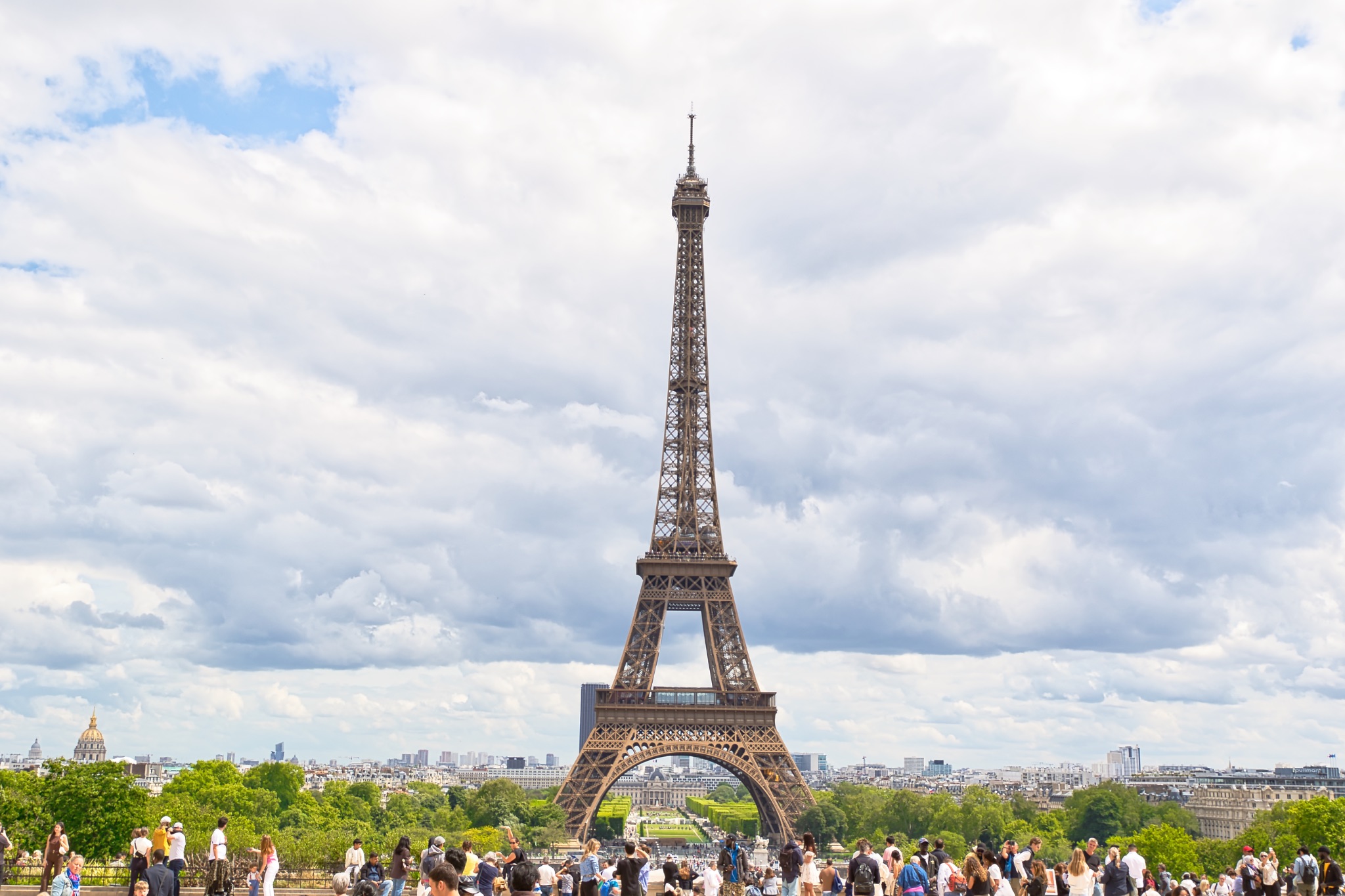 Eiffel Tower, Paris, with People and Cloudy Sky
