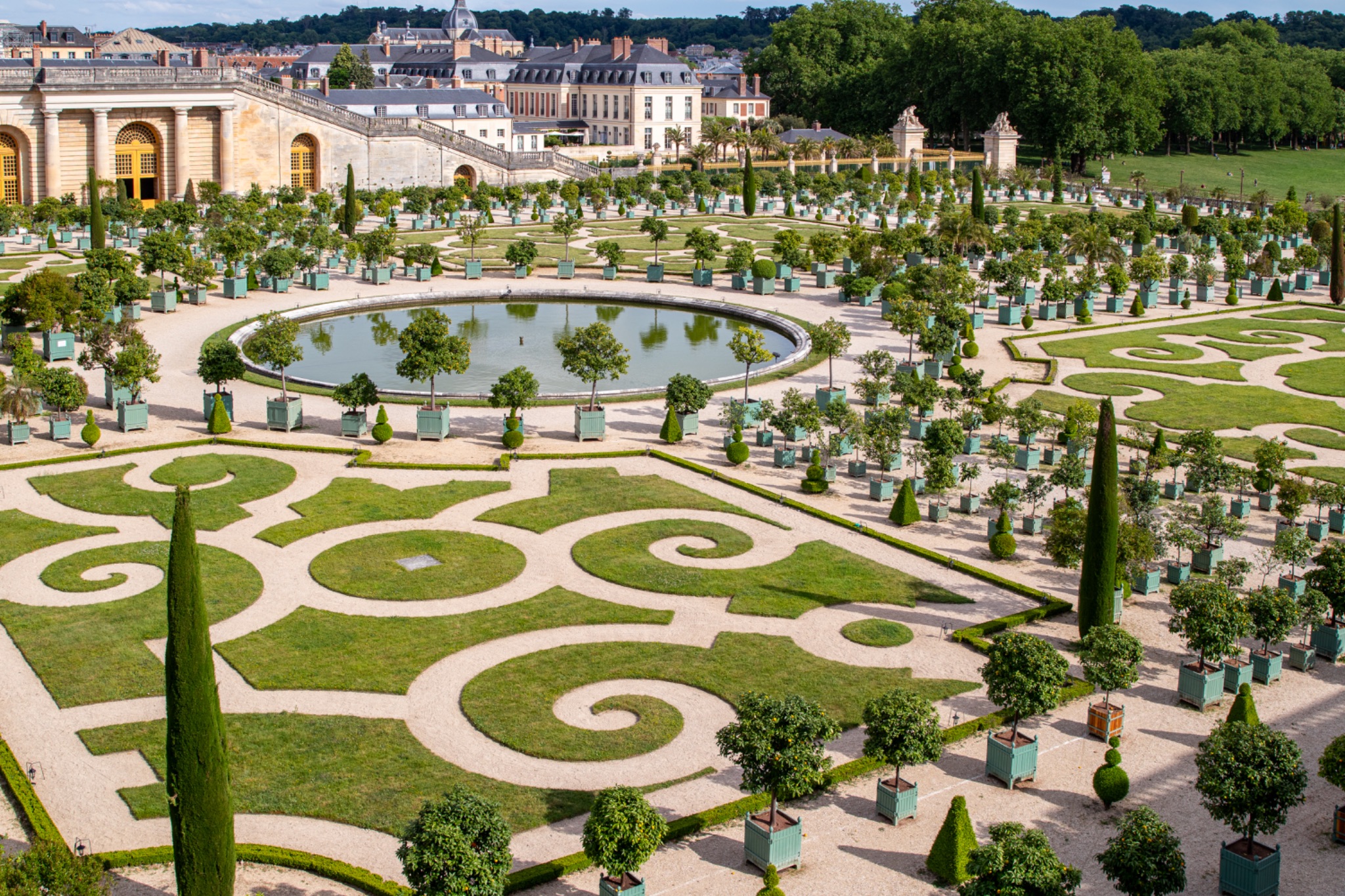 Formal Garden at Versailles with Circular Pond and Building Complex